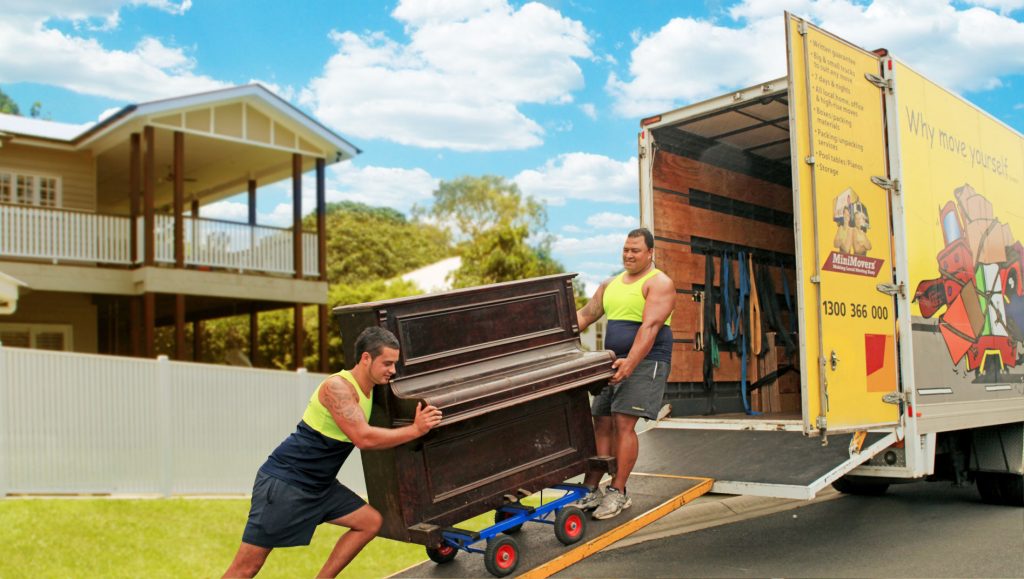 Professional Removalists Moving a Piano